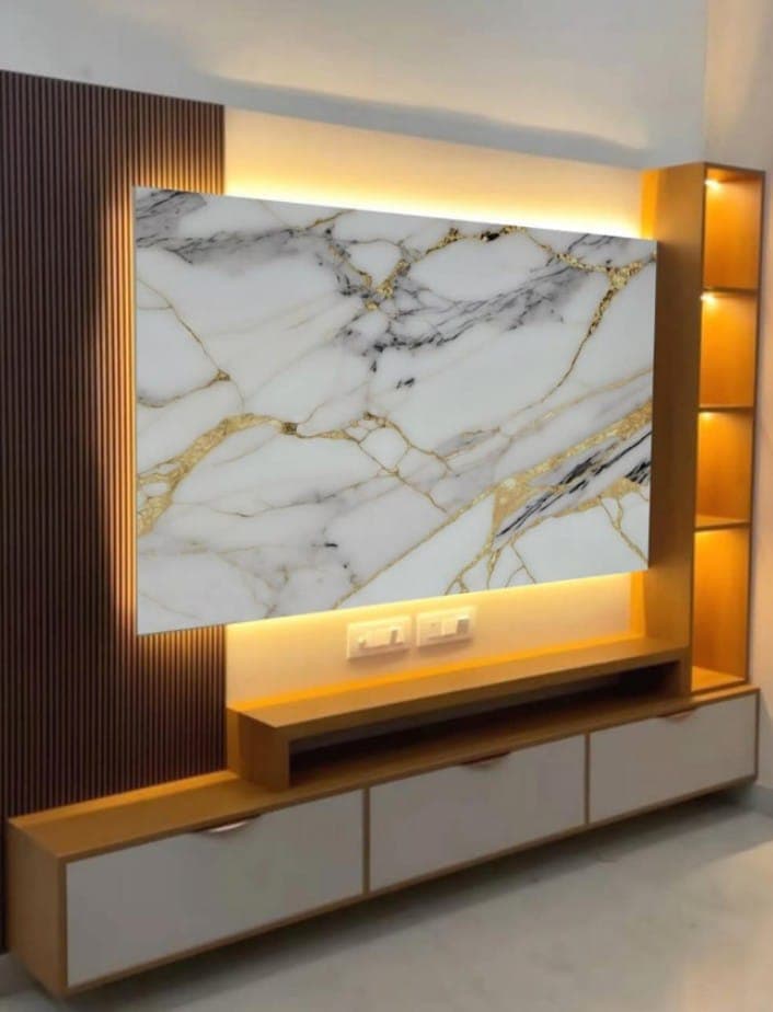 Backlit marble TV wall with golden veins, wood slats and floating drawers, Bikaner