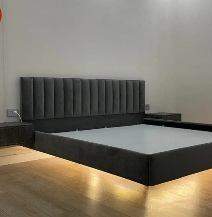Floating bed with upholstered headboard and under-bed LED lighting, bedroom interior Bikaner